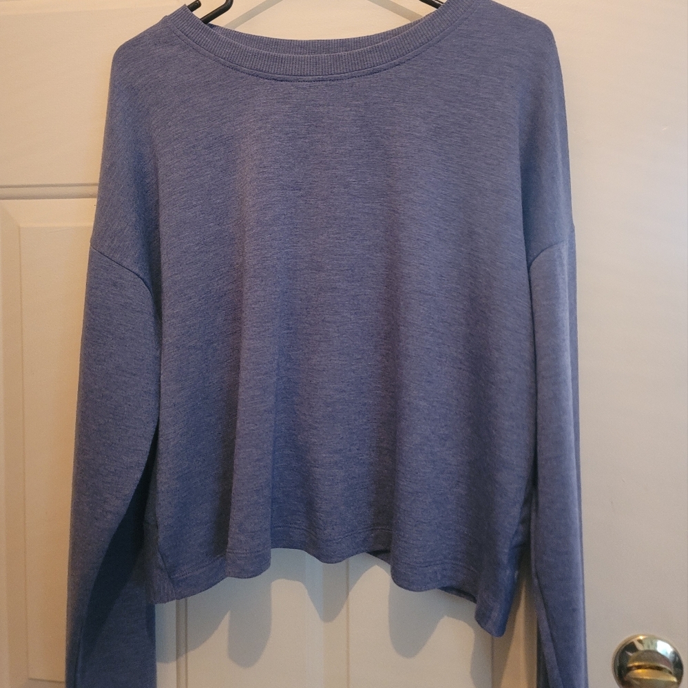 Cute denim blue sweater with a split back